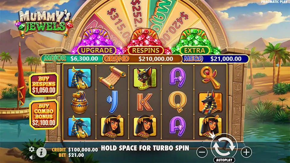 Mummy's Jewels slot grid with Egyptian gods, queens, ankhs, and gem wheel in desert background.