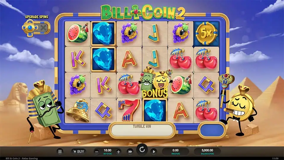Main reels filled with colorful fruits, gems, and symbols, with Bill and Coin characters standing on each side.