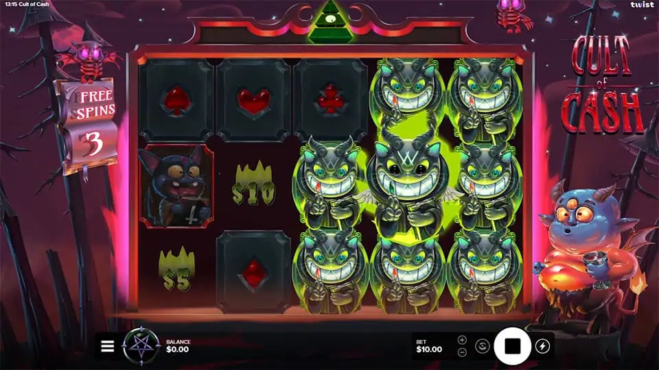 Reels packed with glowing wild monster symbols and payout values like $10 and $5 during Free Spins round.