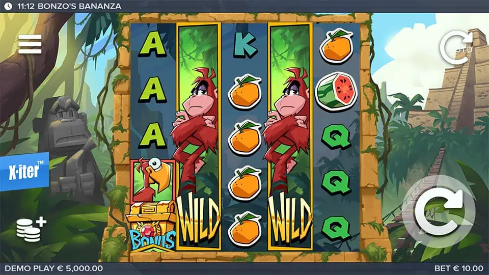Jungle-themed reels packed with oranges, parrots, letters, and stacked monkey wilds, framed by stone ruins and tropical foliage.