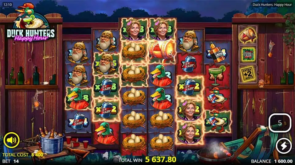 Duck Hunters: Happy Hour slot showcasing active bomb feature with exploding symbols and multipliers during free spins in a night-time setting.