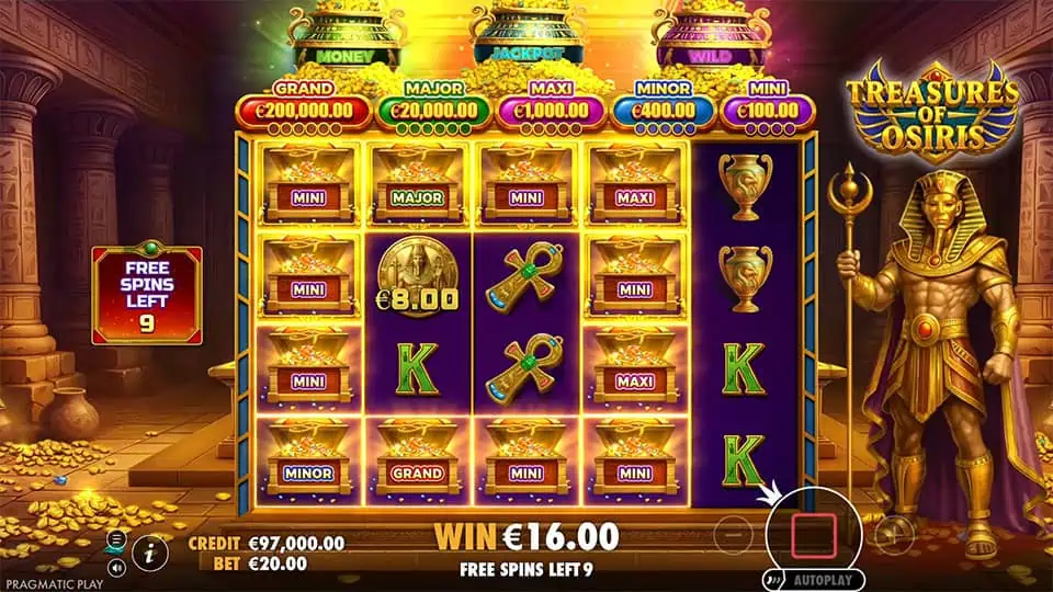 Free spins mode with golden chests, keys, and jackpot tags on the reels, framed by temple columns and glowing piles of treasure.