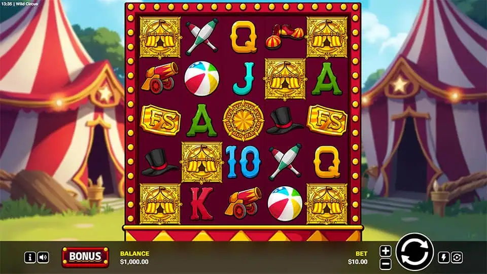 Base game screen of Wild Circus slot showing circus-themed symbols like cannons, hats, and juggling pins against a backdrop of red and white circus tents.