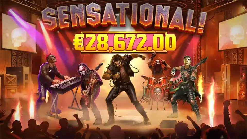 Full rock band on stage with “SENSATIONAL!” win banner and crowd cheering.